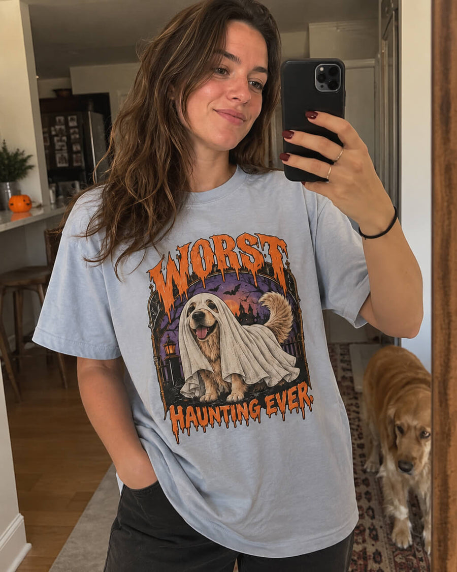 Golden Retriever Halloween oversized T-shirt in Light Washed Denim worn by a woman taking a mirror selfie with her Golden Retriever