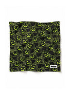 Green Pumpkin dog bandana in black with a neon green jack-o-lantern pattern, laid out flat