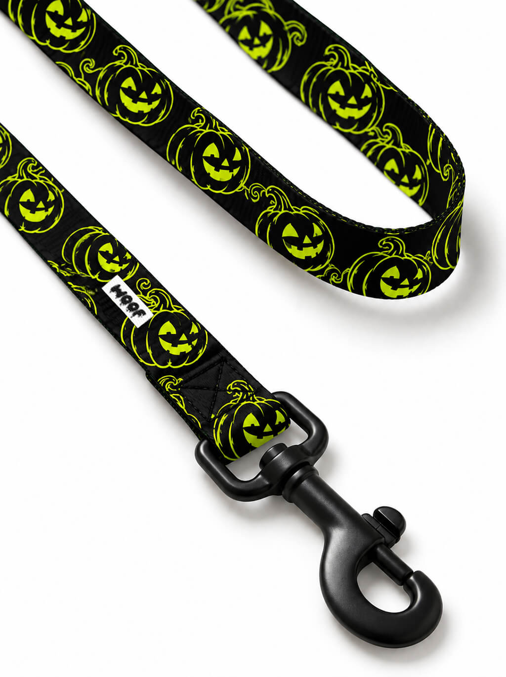 Close-up of the Green Pumpkin leash handle with neon green jack-o-lanterns and matte black snap hook