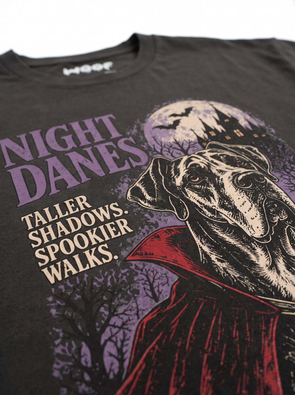 Close-up of the "Night Danes – Taller Shadows, Spookier Walks" print with a Great Dane in a vampire cape on the Washed Black tee