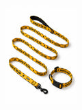 Haunted Hound dog collar and leash set in yellow and black with a Beware of the Dog print, laid out flat