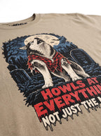Close-up of the "Howls at Everything, Not Just the Moon" print with a Husky howling at the full moon on the Khaki tee