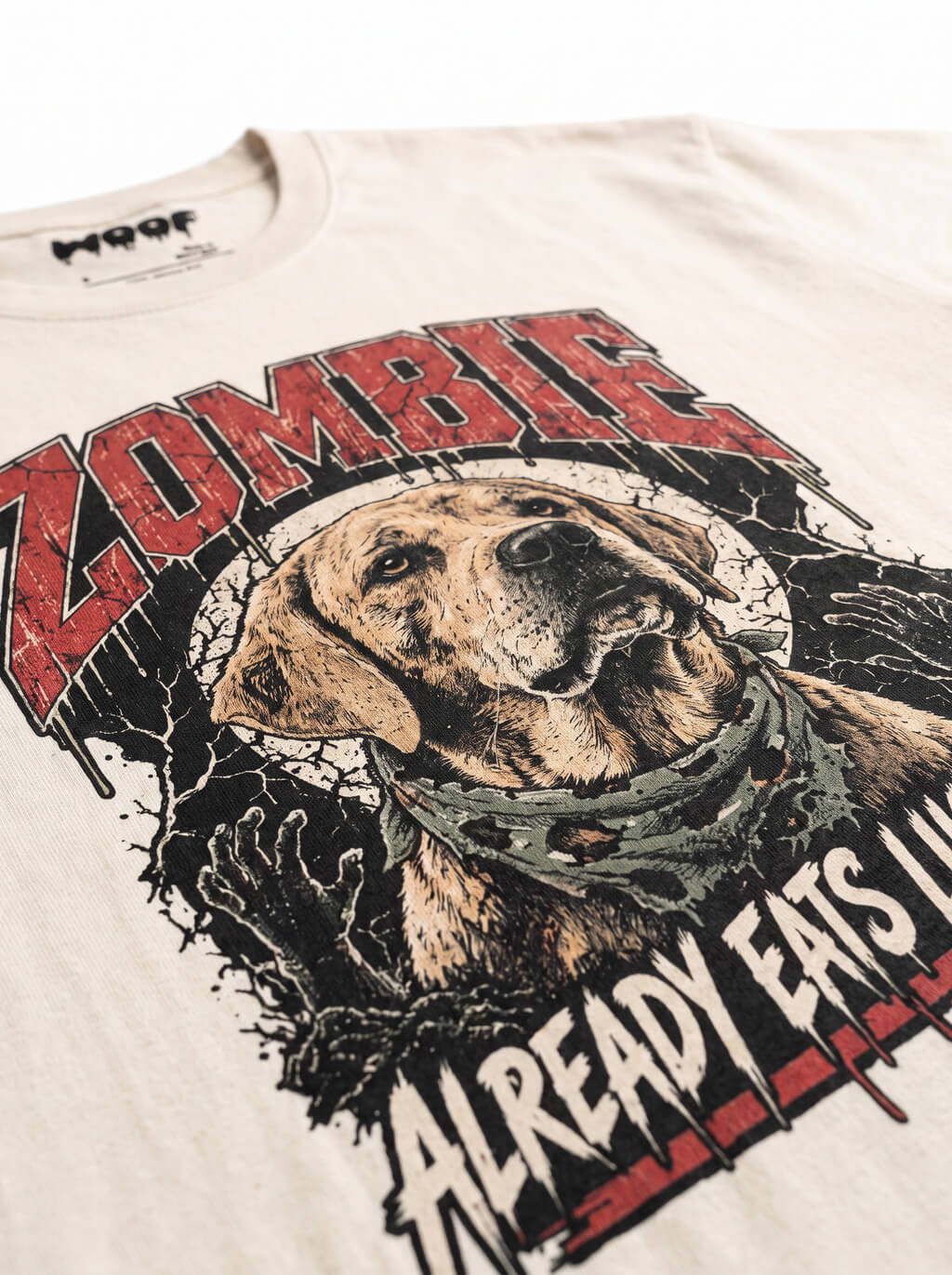 Close-up of the "Zombie – Already Eats Like One" print with a zombie Labrador on the Vintage White tee