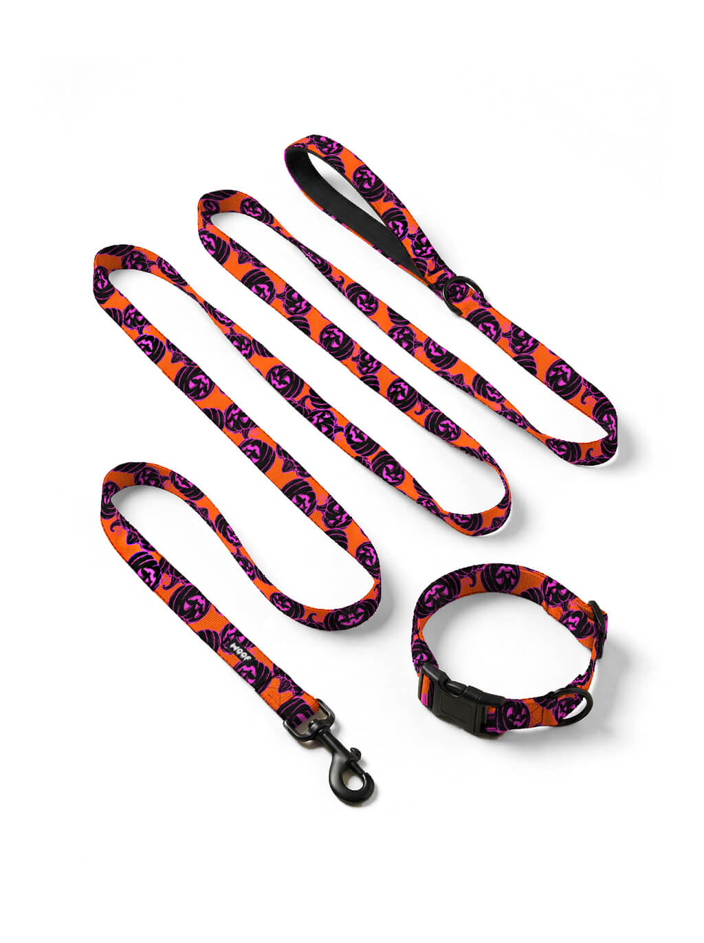 Orange Pumpkin dog collar and leash set in orange with a black and pink jack-o-lantern print, laid out flat