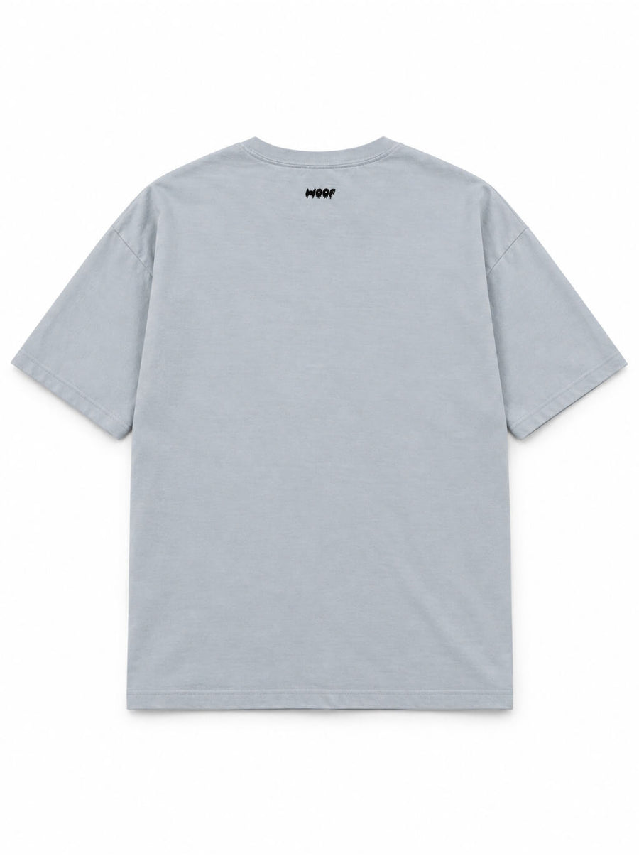 Back of the Paranormal Loaf Corgi oversized Halloween T-shirt in Light Washed Denim with small WOOF logo below the collar