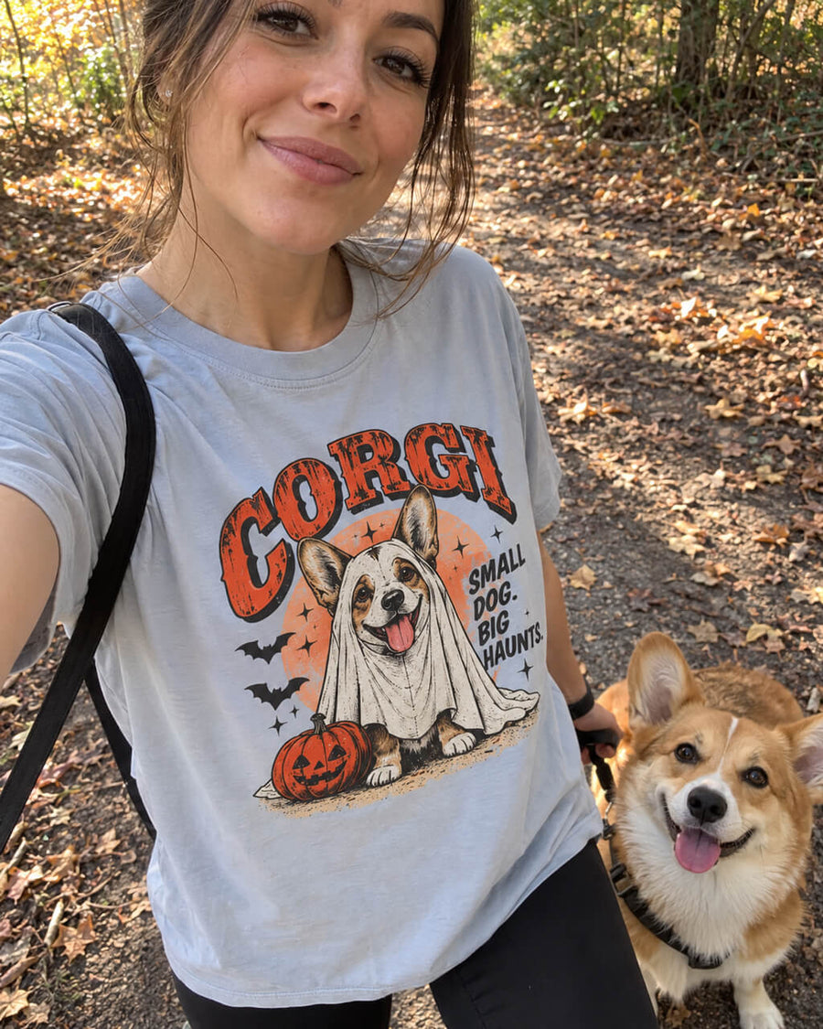 Paranormal Loaf Corgi oversized Halloween T-shirt in Light Washed Denim worn by a woman on an autumn walk with her Corgi
