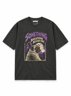 Pug Halloween oversized T-shirt in Washed Black featuring a Pug looking back in a spooky graveyard, front view