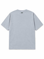Back of the Skeleton Dachshund oversized Halloween T-shirt in Light Washed Denim with small WOOF logo below the collar