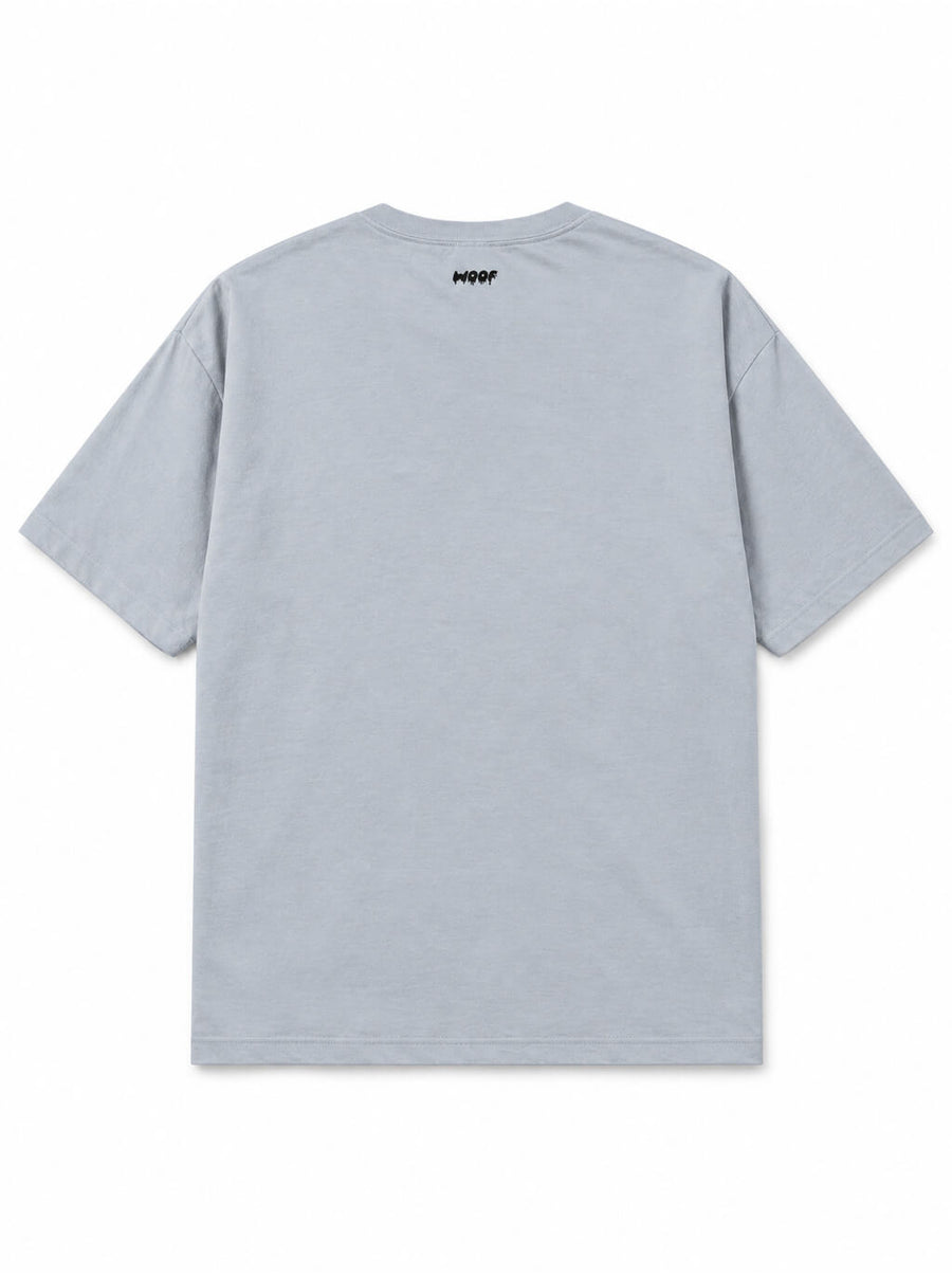 Back of the Skeleton Dachshund oversized Halloween T-shirt in Light Washed Denim with small WOOF logo below the collar
