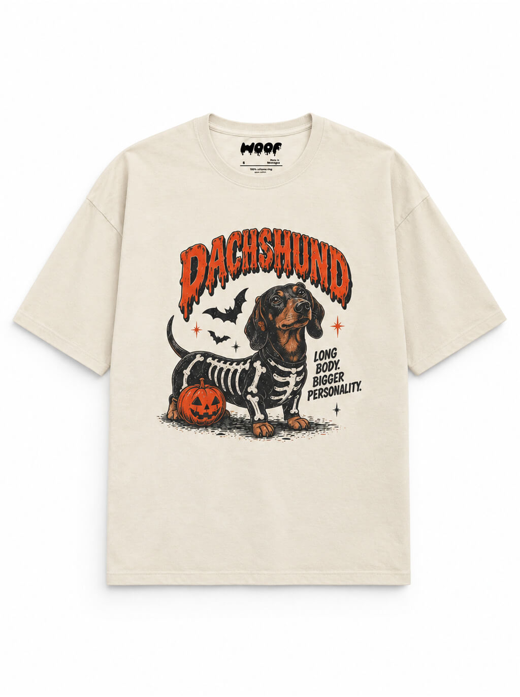 Skeleton Dachshund oversized Halloween T-shirt in Vintage White featuring a Dachshund in a skeleton costume with pumpkins, front view