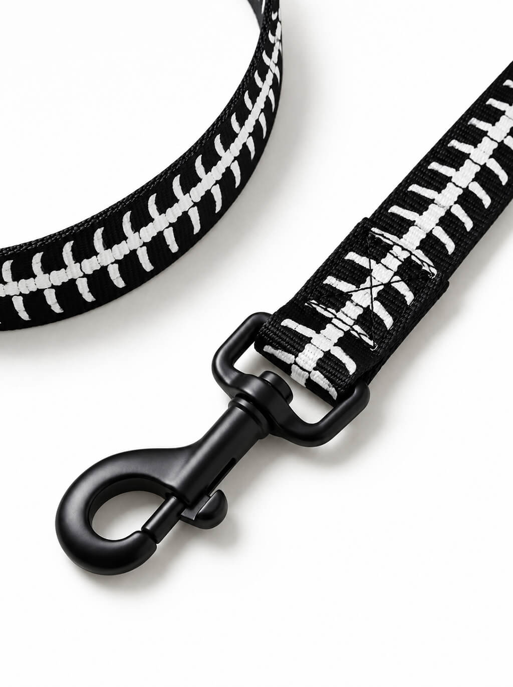 Close-up of the Skeleton leash with white bone print and matte black snap hook