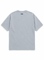 Back of the Treat First Corgi oversized Halloween T-shirt in Light Washed Denim with small WOOF logo below the collar