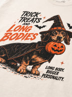 Close-up of the "Trick, Treats & Long Bodies" print with a Dachshund in a witch hat with a pumpkin bucket on the Vintage White tee